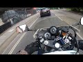 BMW overtakes on roundabout.