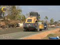 Heavy road construction machinery, a Motor grader, road rollers, working on a road-building project