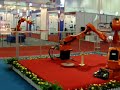 Industrial Robots handling a soccar ball