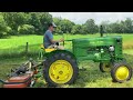 Mowing tall grass with a 1947 M and a Titan finishing mower #johandeere #cuttinggrass #oldtractors