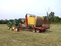 loading small square bale hay with 1033 balewagon newholland