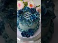 Vanilla cake adorned with blue buttercream floral decorations.💙🩵💙 #cakedecorating #vanillacake #cake