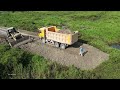 Awesome Mighty bulldozer and truck building new road across forestry swamp