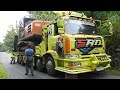 Hitachi Zaxis 200 Excavator Transport With Self Loader Trucks To The Road Construction Site