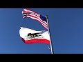 American Flag and California flag waving in the wind
