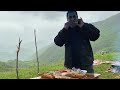Butchering and Cooking 2 Lambs on the Top of a Hill Next to an Abandoned Town