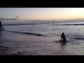 Camille catching the last waves at Waikiki