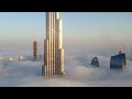 Burj Khalifa and Dubai Downtown are raising from the fog