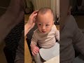 Baby pulling its own hair and crying
