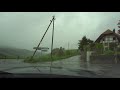 Driving in rain in the Swiss countryside through forests, wooden bridges, mountain passes and clouds