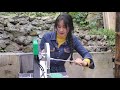 Mountain village girl repairs old-fashioned cutting machine, spring rusty belt breaks
