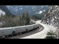 Big Grain Train Snaking Along The Trans-Canada Highway In The Fraser Canyon