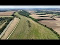 Drone, aerial video of rolling countryside at Combe Gibbet, near Inkpen in Berkshire, UK