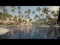 empty tropical resort pool in summer slow motion