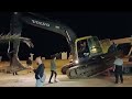 Excavator at night