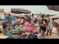 Market day in one  of the biggest markets in Togo. Buying food stuffs, thrift clothes and shoes .