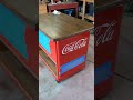 Painting embossed letters on coca cola cooler