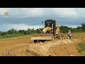 The best construction site with operating yellow LIUGONG motor grader spreading land and compactors