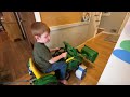 Christmas cleanup with kids ride on Tractor and water trailer inside. Educational | Kid Crew