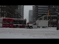 T.T.C. Bus pushed by truck in snow ...