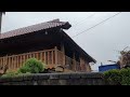 Heavy rain hits a village in the mountains of Vietnam. Walking in the rain