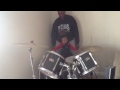 Kamari playing the drums