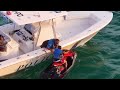 LADY DESPERATELY LEAPS ONTO POLICE BOAT AT HAULOVER !! | Boats vs Haulover Inlet