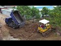 Nicely starting a new project by bulldozer D31P Komatsu push trees &soil, 5ton dump truck Landfill