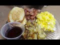 pancakes/bacon/ fried potatoes and onions/ cheesy eggs,/ coffee/ chocolate milk