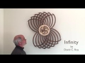 Winding the Infinity Kinetic Sculpture by David C. Roy
