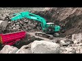 Extreme sand mine on the mountain slope, The skills of the excavator operator dredge high cliffs