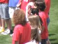 Sydney Grace and her school chorus sing National Anthem at baseball game
