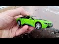 Various die cast Cars Getting Washed With Water