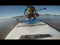 Paddleboard dog makes a quick trip to some sand dunes