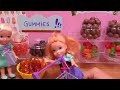 Candy store ! Elsa & Anna toddlers shop for colorful candies