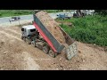 Perfect filling by 25ton Dump trucks and SHANTUI DH17c3 Pushing ground into huge lake