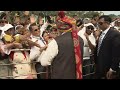 PM Modi greets the people at the seating arena