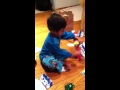 Noah opening gifts