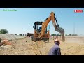 JCB 3DX backhoe loader working excavation for new installation underground electrical cable