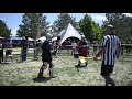 Medieval Knight breaks opponents helmet during full contact armored combat and knocks him down