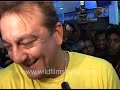 Media swarms around Sanjay Dutt as he attends an event, scene ends in shouting and jeering from mob