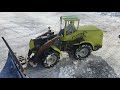 RC loader pushing snow