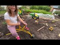 Hauling dirt and finding toy with kids backhoe digger and construction truck. Educational | Kid Crew