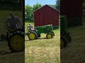 1947 John Deere M raking hay with a pine straw rake #johndeereclassic #oldtractors #johndeere