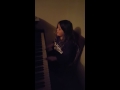 Kennedi singing and playing piano