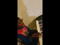 Isaiah playing the piano