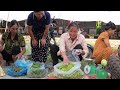 Harvesting papaya fruits and flowers for sale - Xuan works in a construction company