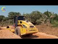 Amazing technology of an embankment new road construction in rural with a motor grader, road roller