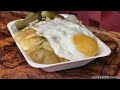 Yummy Swiss Raclette. Warm Melted Swiss Cheese with Egg and Potatoes. London Street Food