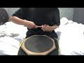 Playing the back of my snare drum pads.